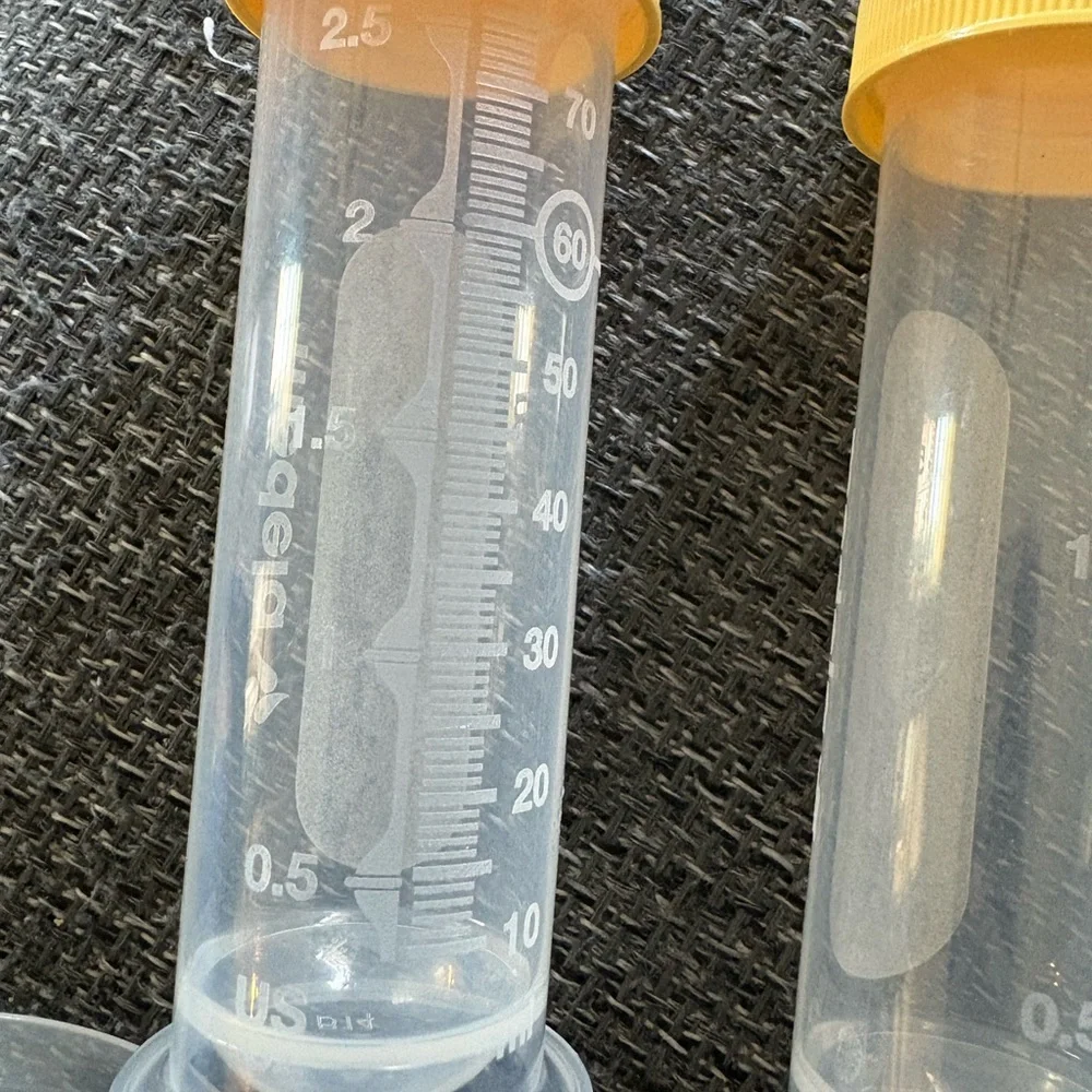 Medela Clear Breast Milk Bottles and Yellow Lid Pump Accessories